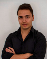 Professional headshot of Alex Novkov