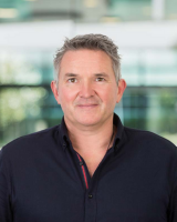 Professional headshot of Gwyn Thomas