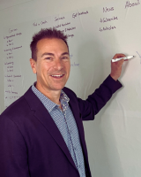 Professional headshot of Simon Powers